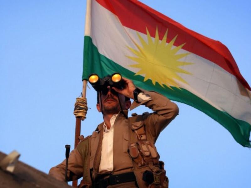A Kurdish Peshmerga fighter holds a position on the front line in the Gwer district, 40 kilometers south of Erbil. (Photo: AFP)