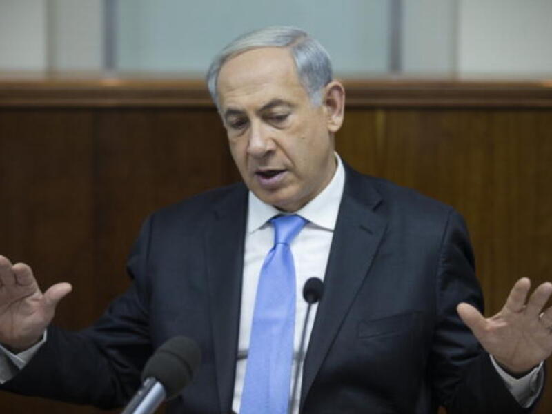 Israel's Prime Minister Benjamin Netanyahu chairs the weekly cabinet meeting on December 8, 2013 in Jerusalem, Israel. [Getty Images]