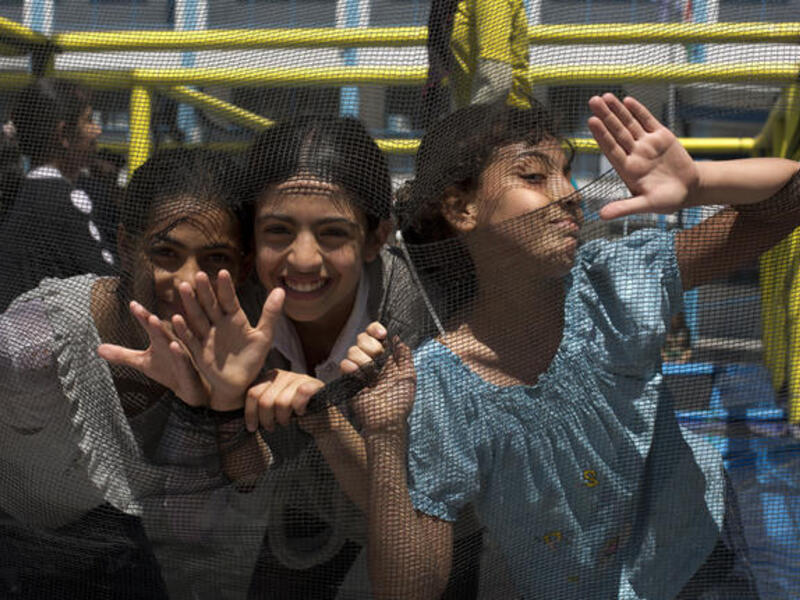 Palestinian girls from UNRWA schools play at a summer camp organised by UNRWA in Gaza City on June 17, 2013. (AFP/MOHAMMED ABED)