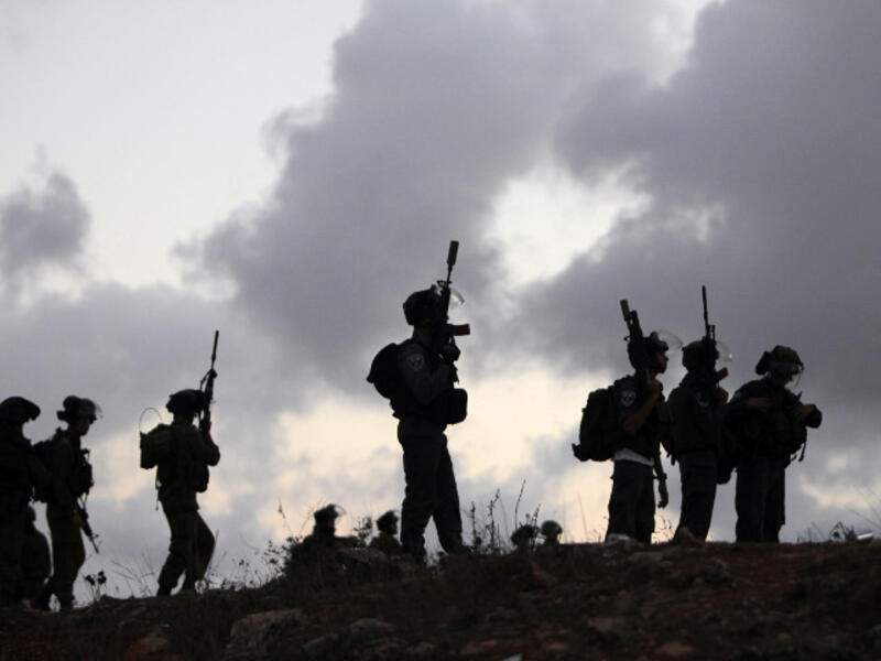 Israeli soldiers stand guard during a tense situation. (Image credit: AFP)