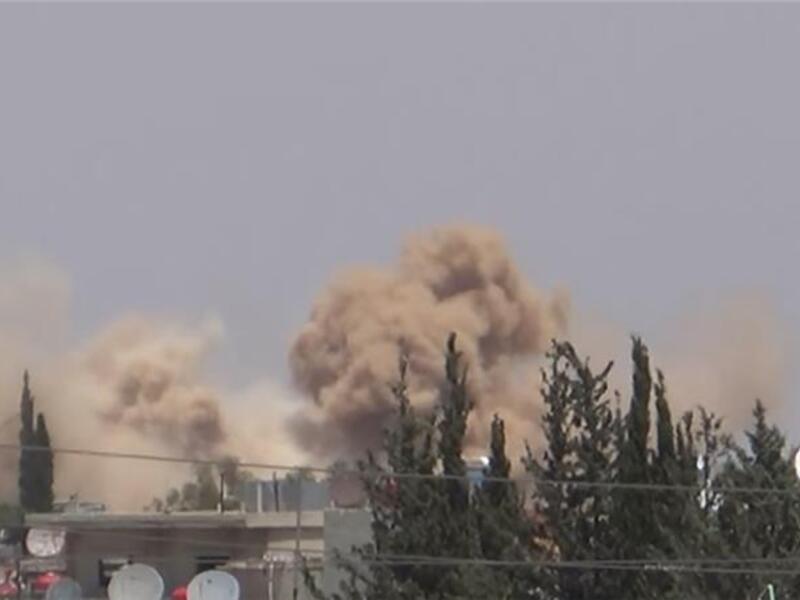 Screenshot taken from Youtube of Khan al-Shih being hit by barrel bombs. (YouTube) 