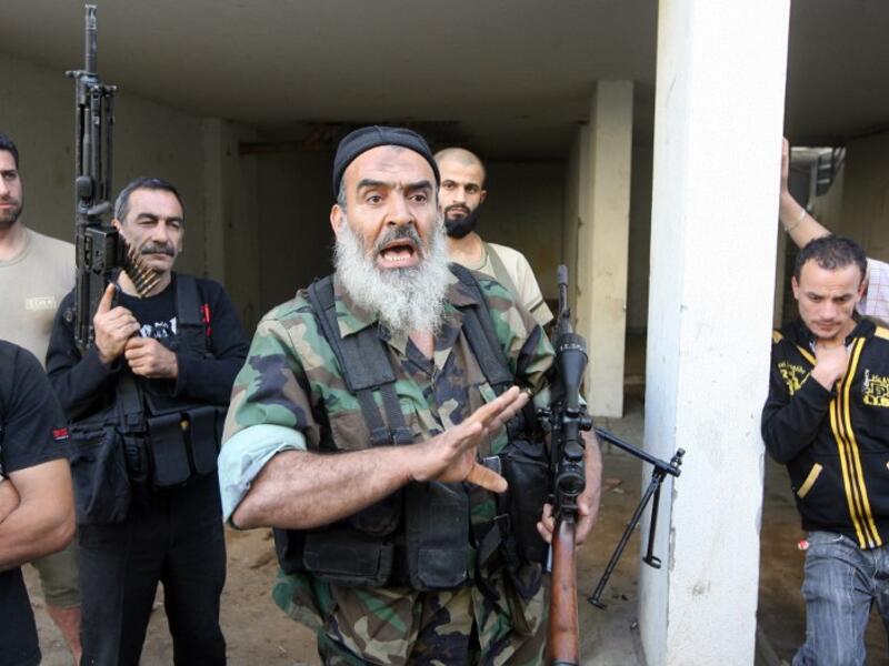 Sunni Salafist gunmen, who back the Syrian opposition, are seen in the northern Lebanese city of Tripoli on May 23 (AFP)