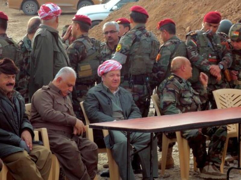 Massud Barzani, the president of Iraq's autonomous Kurdistan region (C-bottom) sits amidst Kurdish peshmerga security forces during a visit to the disputed north Iraq province of Kirkuk. (AFP PHOTO/MARWAN IBRAHIM)