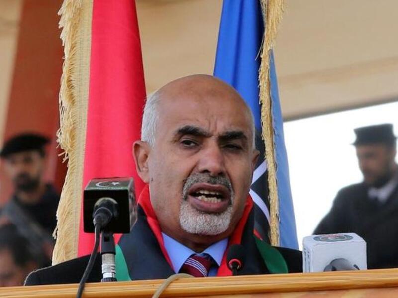 Mohammed el-Megarif delivers a speech during a police graduation ceremony at a police academy in the district of Salaheddin in Tripoli. (AFP PHOTO/MAHMUD TURKIA)