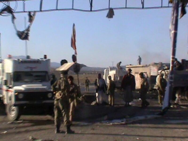 Yemeni soldiers inspect the site were a suicide car bomb killed 11 soldiers in the city of Saba in central Yemen. (AFP PHOTO/STR)