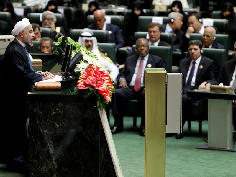 Iran's President Hasan Rowhani (L) delivers a speech after being sworn in before parliament in Tehran on August 4, 2013. (AFP)