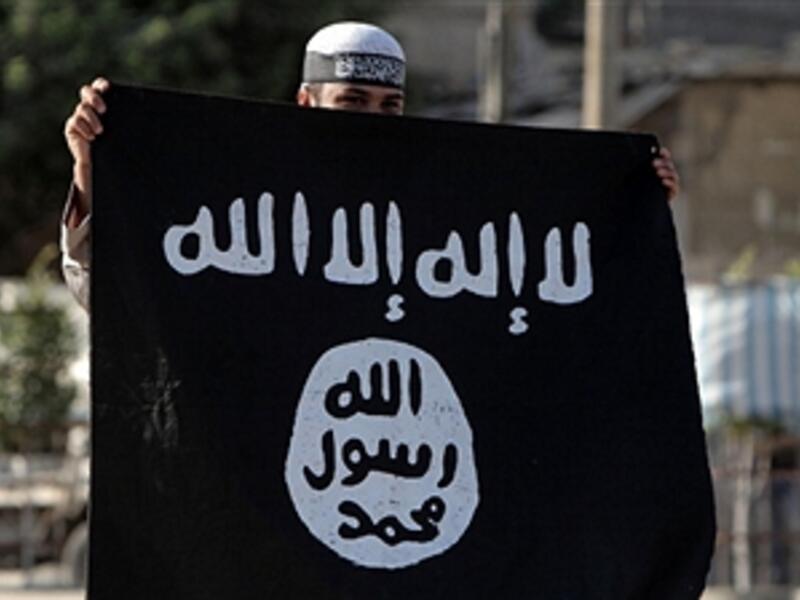 A Palestinian Salafist holds an Al-Qaeda-affiliated flag during a protest against an amateur film mocking Islam in Rafah in the southern Gaza Strip on September 14, 2012. (SAID KHATIB/AFP/GettyImages)