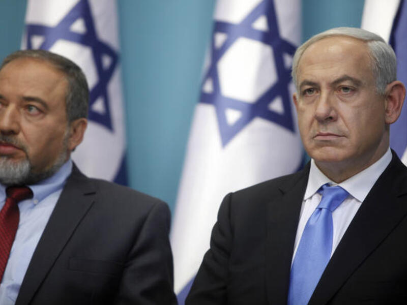 Avigdor Lieberman (L) with Israeli prime minister, Binyamin Netanyahu (R)