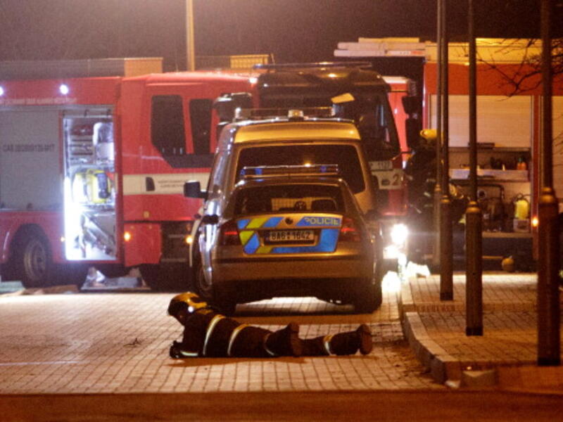 Firefighters work outside the residence of the late Palestinian ambassador Jamal al-Jamal on January 1, 2014 in Prague, Czech Republic. [Getty Images]