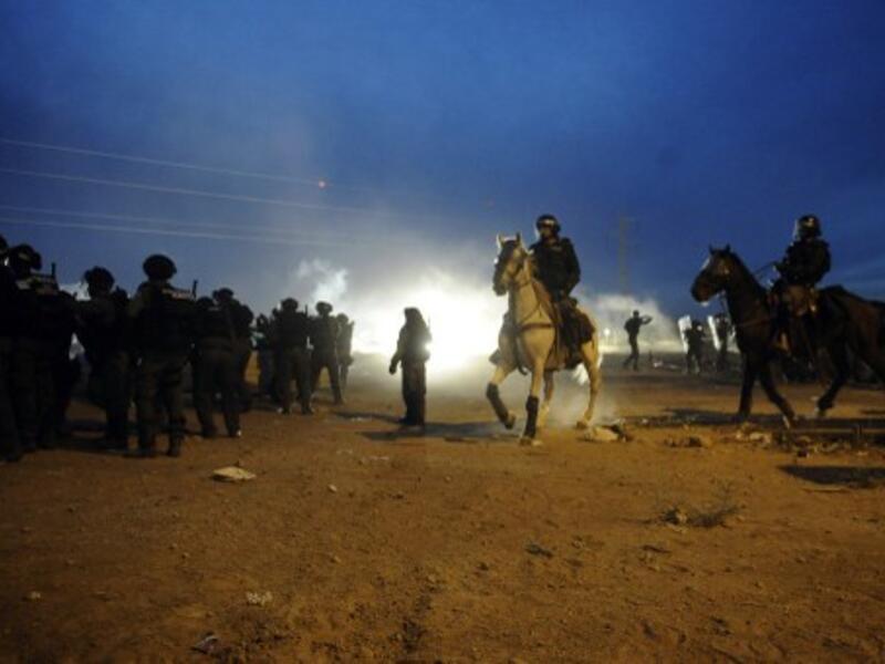Mounted Israeli security stand guard as Bedouins protest against the Prawer plan in the southern village of Hura on November 30, 2013. (AFP)