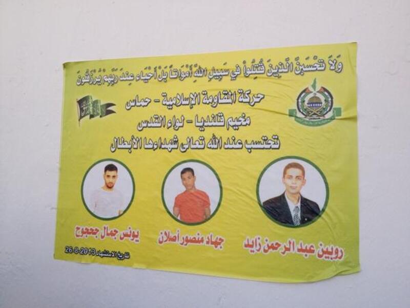 A "Martyrs" poster in Qalandiya refugee camp shows the portraits of three Palestinians killed by Israeli soliders in a pre-dawn raid on the West Bank camp. (Image via Twitter) 
