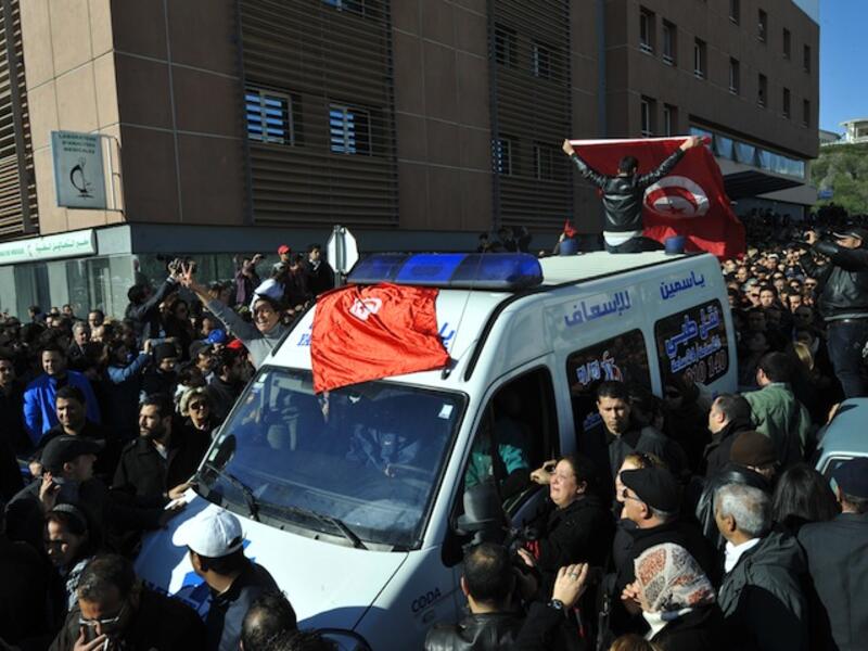 The body of Tunisian opposition leader and outspoken government critic Chokri Belaid, shot dead with three bullets fired from close range by a man wearing a traditional long garment with a pointed hood on Wednesday.