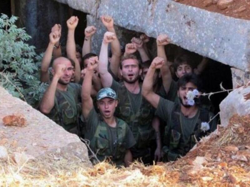 AFP PHOTO / HO / SHAAM NEWS NETWORK: FSA soldiers on a training exercise
