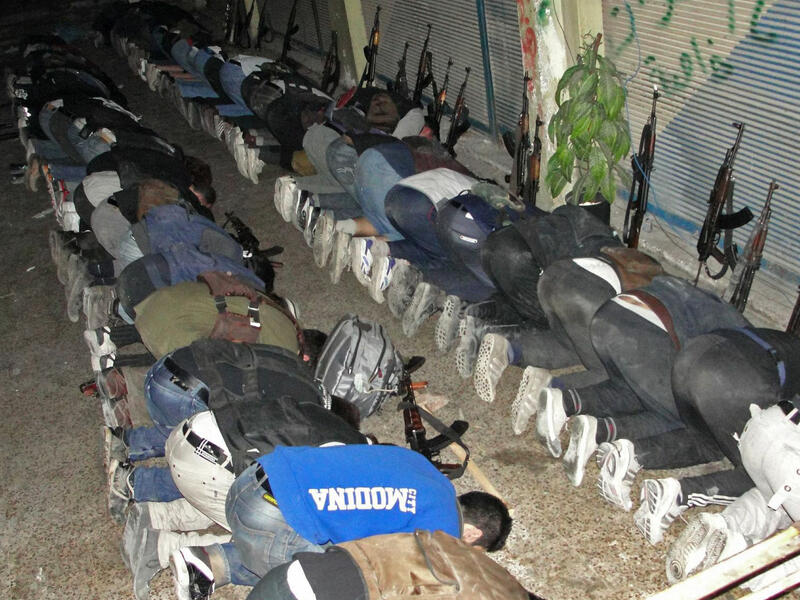  A handout picture released by the opposition-run Shaam News Network on June 21, 2013 shows rebel fighters praying in Syria's central city of Homs on June 17. (AFP/MOHAMMED IBRAHIM / SHAAM NEWS NETWORK