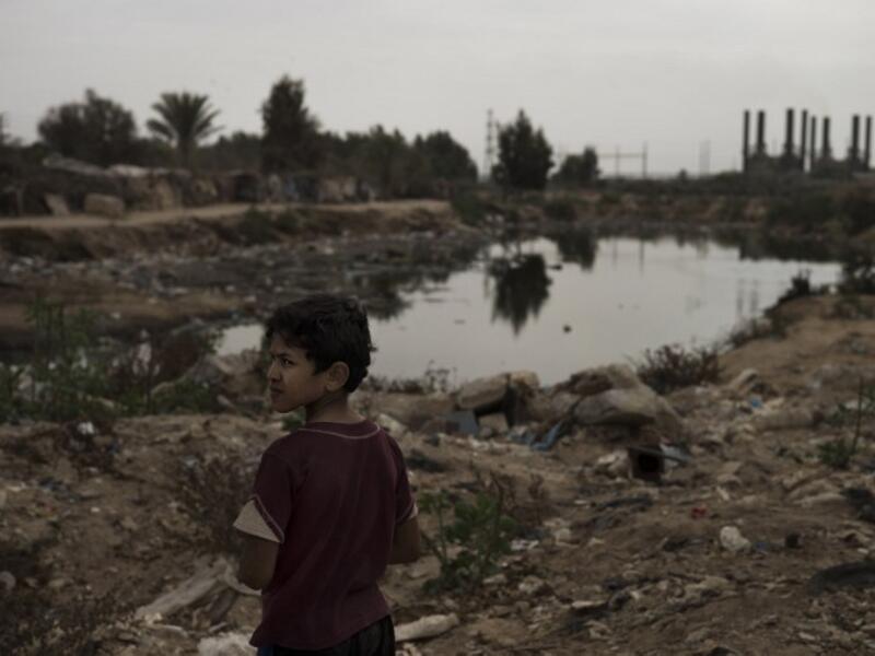During a phonecall with Gazan Prime Minister Ismail Haniyeh, Russian Foreign Minister Sergei Lavrov said that Moscow wants a "speedy" end to Israel's harsh blockade of Gaza. Here, a young boy stands by a puddle of raw sewage, caused by the outage of power in the Gaza Strip. (AFP/File)