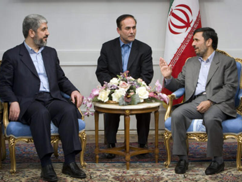 The leaders of Hamas and Iran chat. Image via standfordreview.com