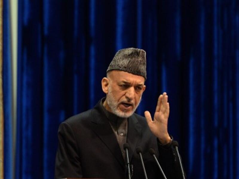 Top Afghan army official Brig. Gen. Abdul Raziq has spoken out against Hamid Karzai's (pictured) reluctance to sign a long-term security pact with the U.S., claiming that the president is emboldening the Taliban. (AFP/File)