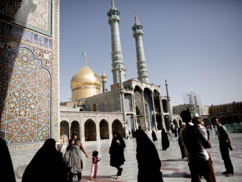 Pilgrims walk across the courtyard of the Massoumeh holy shrine in the religious Shiite Mulsim city of Qom, south of Tehran ahead of the electoral vote on Friday. Iran's powerful bazaar merchants and Shiite clergy spearheaded the 1979 Islamic revolution, but they now play a diminished role in national politics. AFP photo