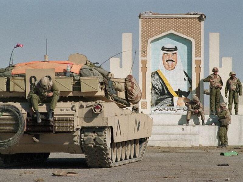 Pictured: the Iraqi invasion of Kuwait in 1990, which Iraq's new government is still paying the price for.