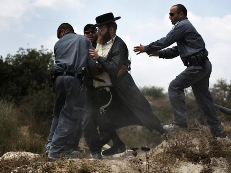 Extremist right-wing settlers from Yitzhar clashed with Israeli security forces over the destruction of illegally built homes. (AFP/File)