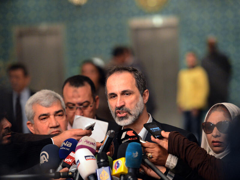 Ahmed Moaz al-Khatib, President of the National Coalition for Syrian Revolutionary and Opposition Forces, talks to the press following his meeting with Arab League Secretary General Nabil al-Arabi. (AFP)