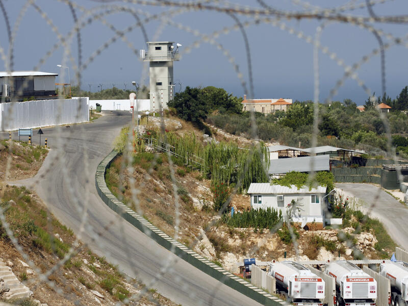 A picture taken through barbed wire on August 10, 2013 shows the base of the Turkish engineering construction company, an unit of the United Nations Interim Force in Lebanon (UNIFIL) in the southern Lebanese village of Saitah. (AFP/MAHMOUD ZAYYAT)