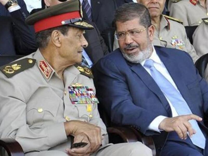 Mohamed Morsi, right, with head of the army Mohamed Tantawi.