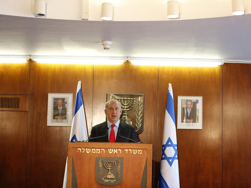 Israel's Prime Minister Benjamin Netanyahu delivers a statement to the media at the Knesset, in Jerusalem (AFP/BAZ RATNER/POOL)