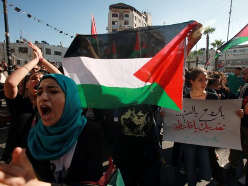  Protesters shout slogans during a demonstration against the Israeli government on July 15, 2013 near the West Bank town of Ramallah. (AFP)