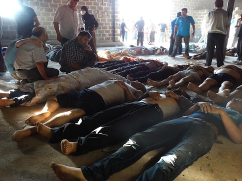 The Free Syrian army alleges that the Syrian regime has transferred enough chemical weapons to Lebanon, via Hezbollah, to "kill half the population". Here, bodies are shown in a makeshift morgue after they were killed by a chemical attack on the suburbs of Damascus on August 21. (AFP/File)