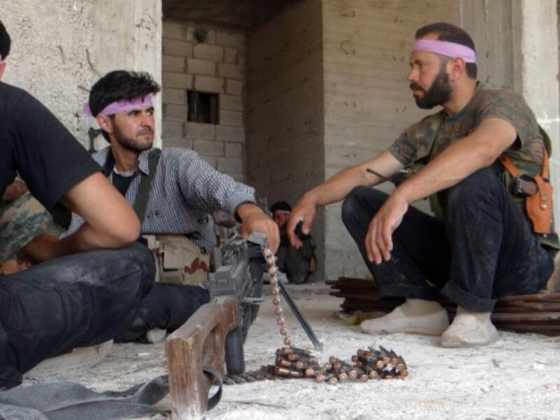 Syrian opposition fighters take a deserved break in Aleppo earlier this year. Saudi-backed rebel fighters - who are quickly overtaking the influence of the FSA - have failed to make major gains in Damascus. (AFP/File)