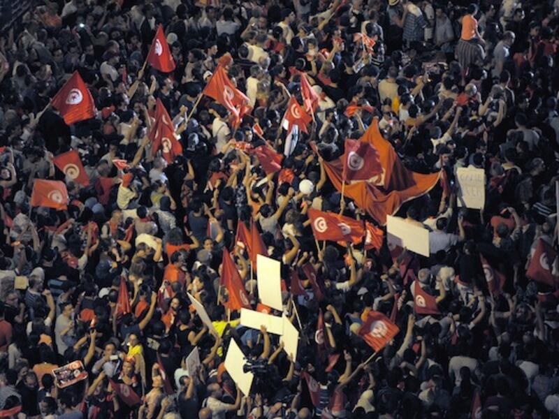 Tunisians chant slogans in front of the National Constituent Assembly on August 6, 2013 in Tunis. (AFP)