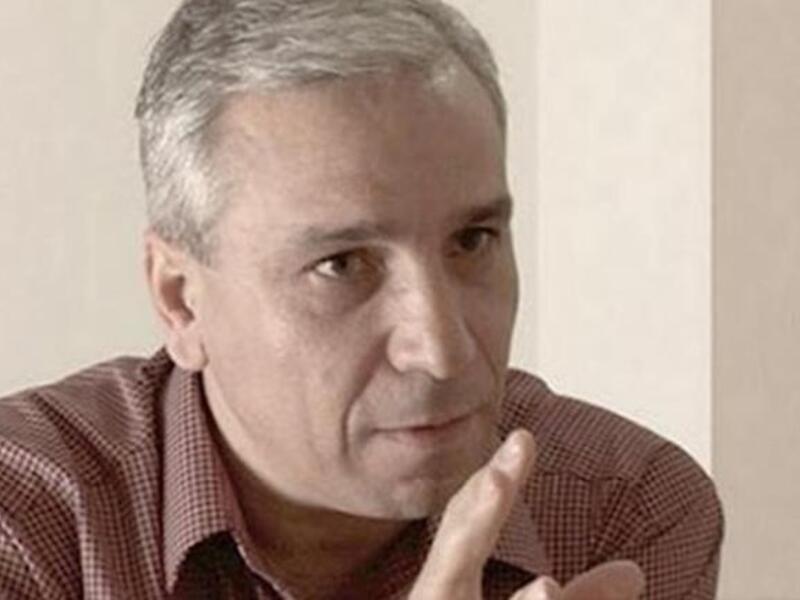 Yassine al-Haj Saleh (top) and part of the jacket of his book on 16 years in Syrian jails.