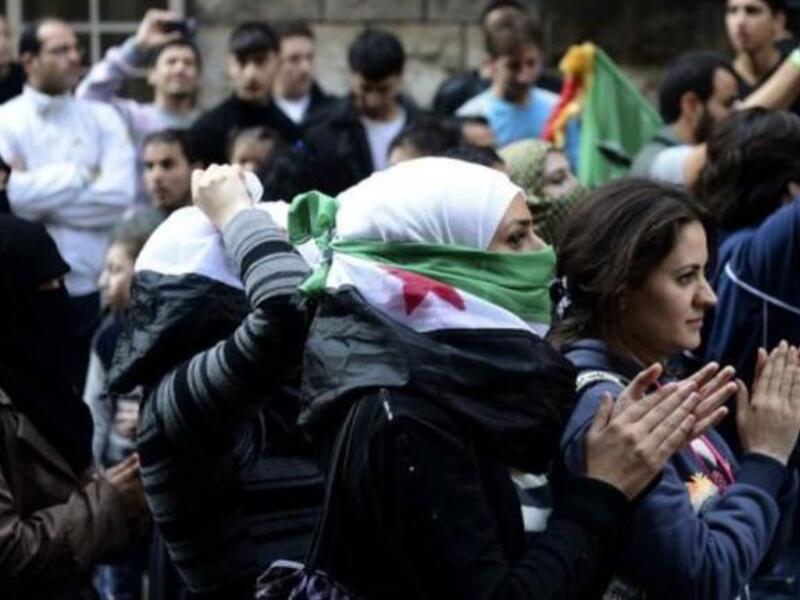 Female protestors in Aleppo, Syria (AFP)