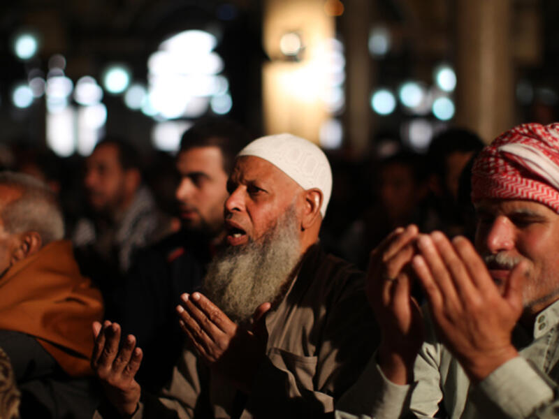 18 Saudi preachers have been detained for mentioning Egypt and Syria in their sermons. Egyptian men attend weekly Friday prayers at Al-Azhar Mosque in Cairo. [AFP]