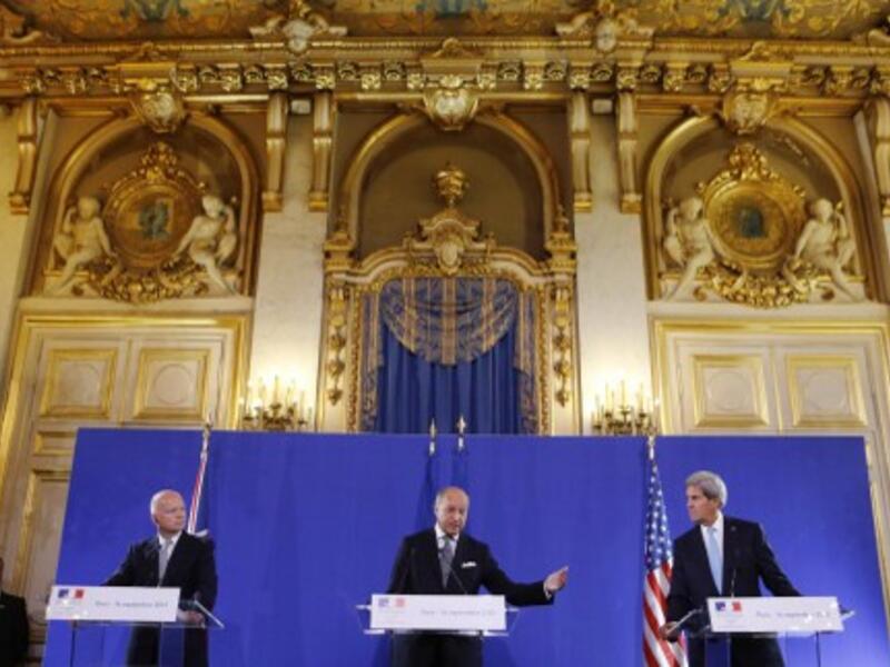  US Secretary of State John Kerry (R) and British Foreign Secretary William Hague (L) listen on September 16, 2013 to French Foreign Minister Laurent Fabius (C) during a press conference at the Foreign Ministry in Paris following their meeting on the Syria crisis. (AFP)