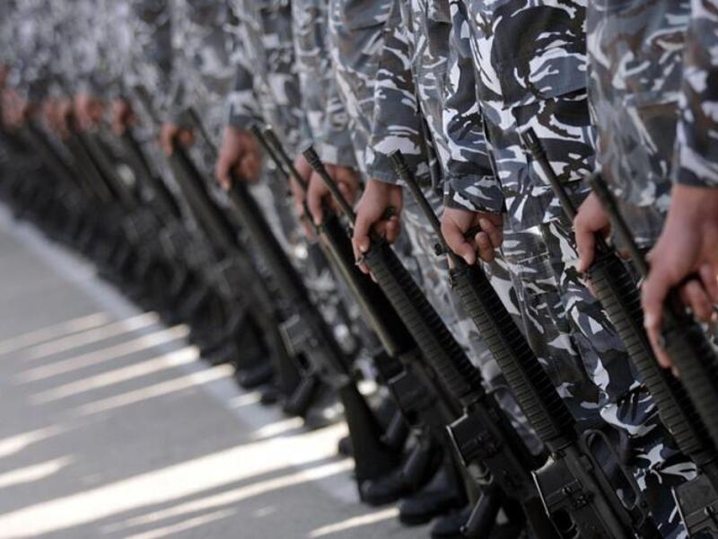 Soldiers serving as bodyguards get valuable experience running errands for politicians ... (Al Akhbar / Haitham Moussawi)