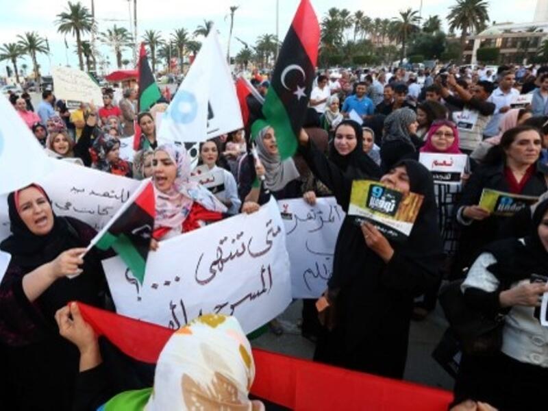 Protestors gathered in Tripoli's Martys' Square Saturday in opposition of calls to renew GNC's mandate, saying that an extension will only "push Libya into further turmoil" (Mahmud Turkia/AFP)