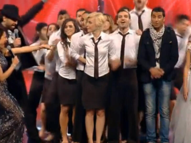 The delighted members of "Sima" congratulate each other as they're announced winners of Arabs Got Talent 2013. (Image: YouTube still)