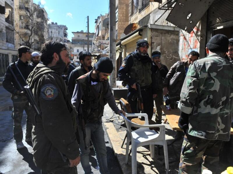 Syrian rebel fighters prepare to go into battle in Aleppo. (AFP PHOTO/BULENT KILIC)