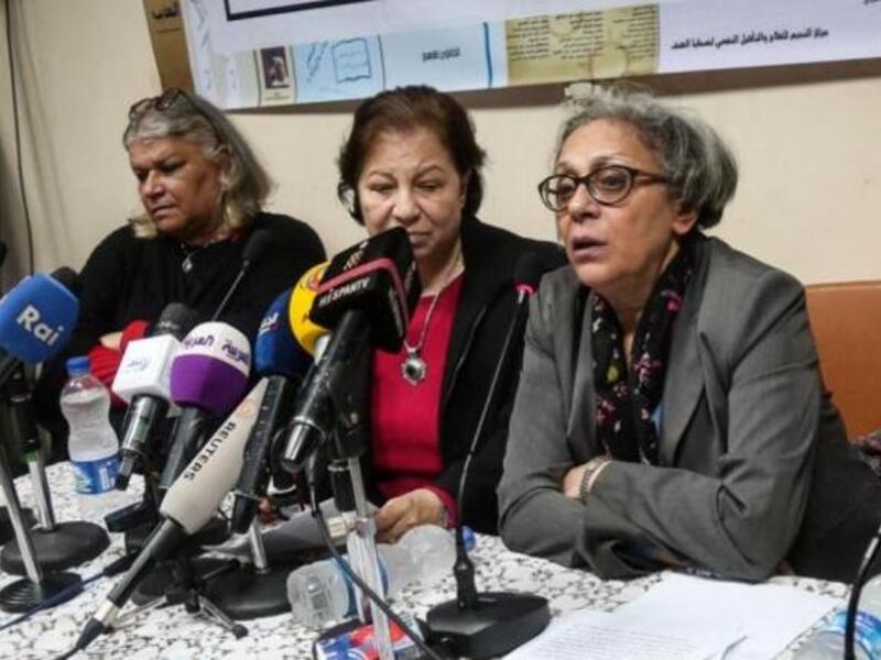 Seif el-Dawla , Suzan Fayyad, center, and Magda Adly, right, co-founder of El Nadeem Center for Rehabilitation of Victims of Violence, hold a press conference in Cairo, Sunday, Feb. 21, 2016. (AFP/Mohamad El Raai)