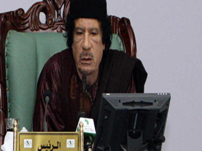 Qaddafi.