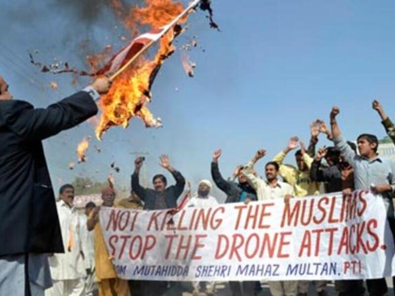 Pakistani men protest against drone strikes. The report said a study showed 74% of Pakistanis considered the US an enemy. [Getty]