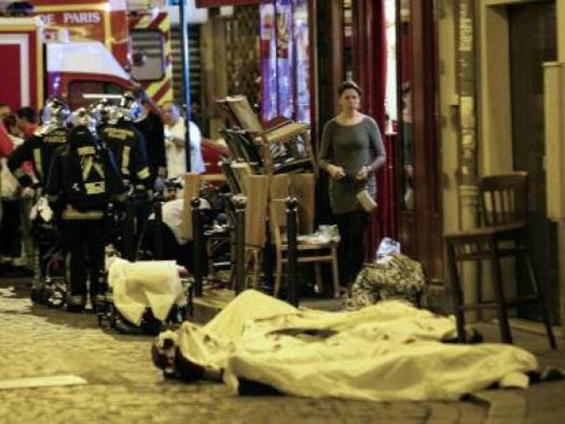 Victims of the November 13 Paris attacks are covered in white sheets after being declared dead at the scene. (AFP/File)
