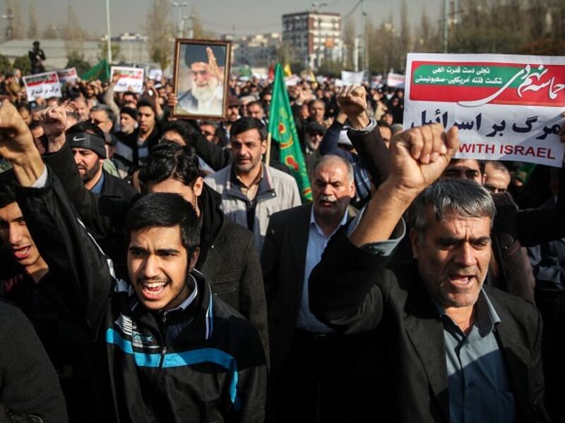 In its latest report, the Iranian Parliament Research Center put the country’s economic growth in the current year at 4.1 percent. (AFP)