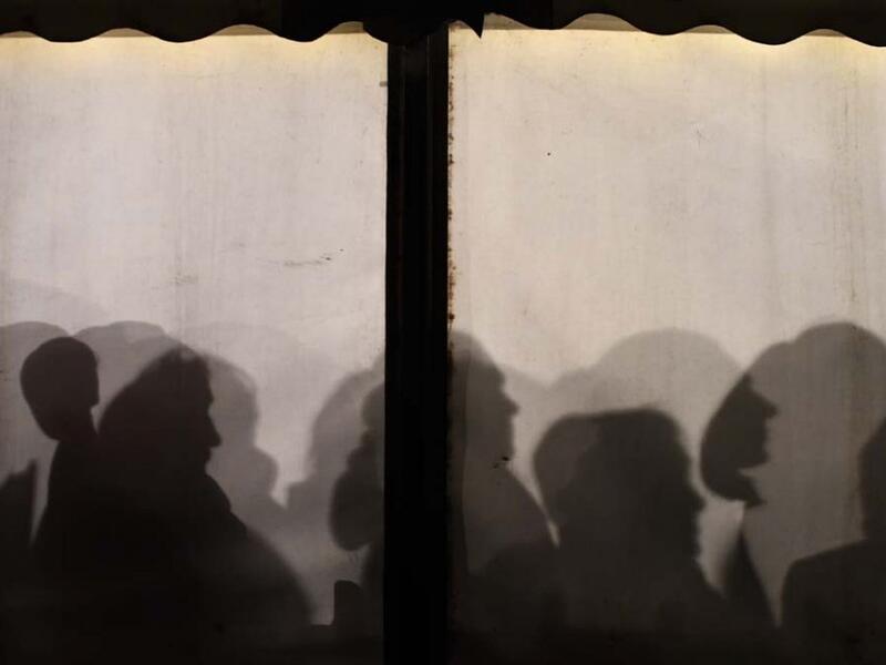 Asylum seekers line up at a government office in Berlin in January 2016.  (AFP/Tobias Shwarz)