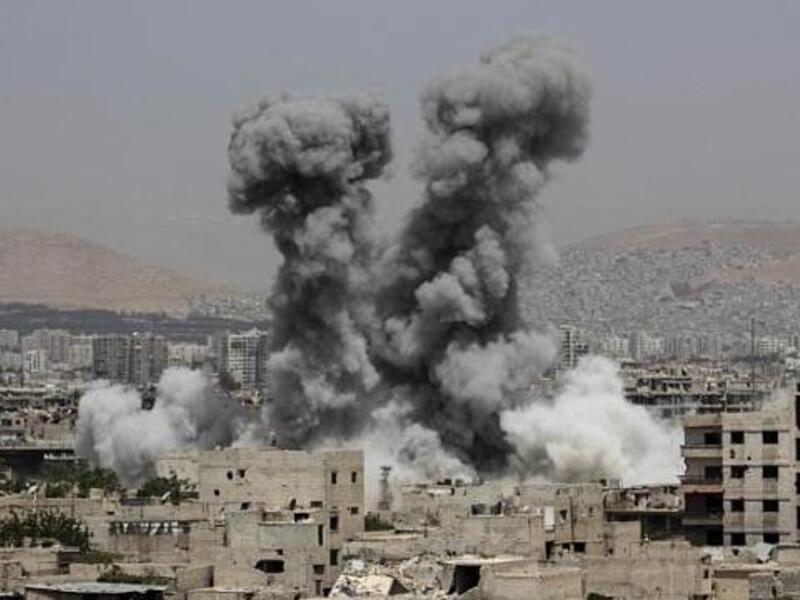 The aftermath of a regime airstrike in an area east of Damascus held by non-government forces (AFP/file)