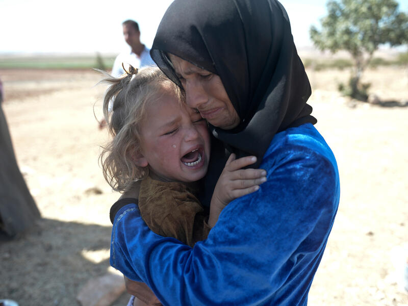 Syrian refugees (Shutterstock)