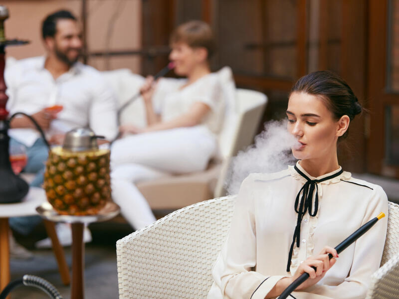 Woman Smoking Shisha (Shutterstock)