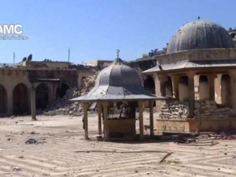 An image grab taken from a video uploaded on YouTube on Wednesday, allegedly shows the rubble of the minaret (background) of Aleppo's ancient Umayyad mosque. (Image: AFP photo / YouTube)